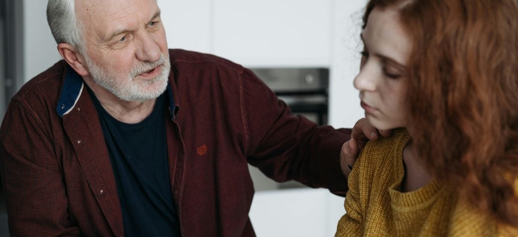 A man comforts a woman